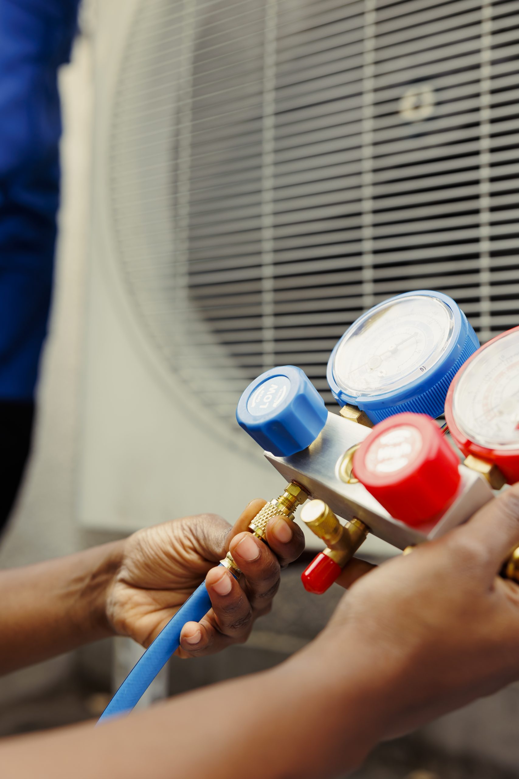 Mechanic holding manometers, close up