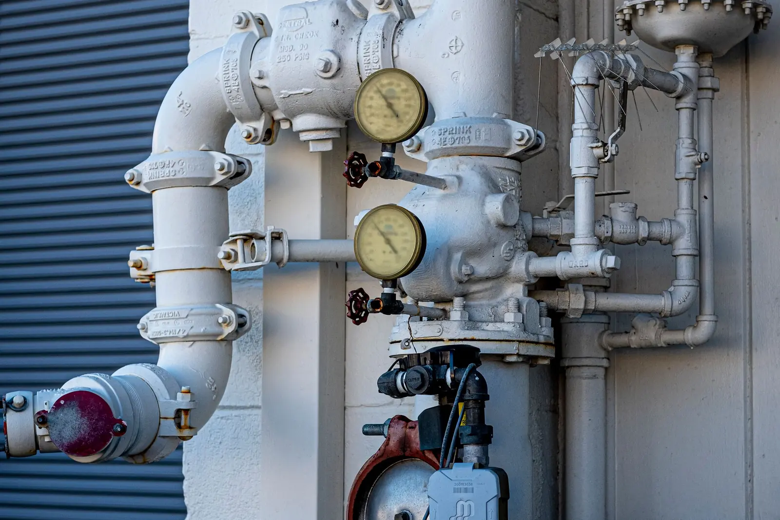 Piping with pressure gauges in a mechanical room