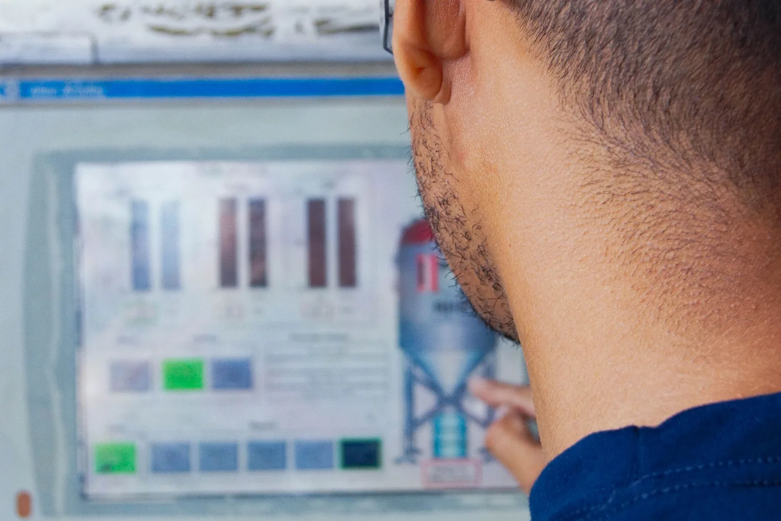 Technician reviewing an equipment control panel