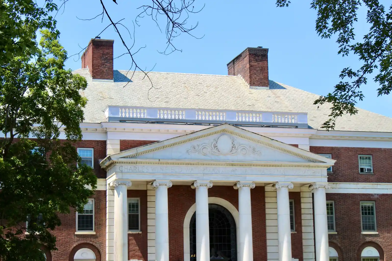 Brick institutional building with white columns