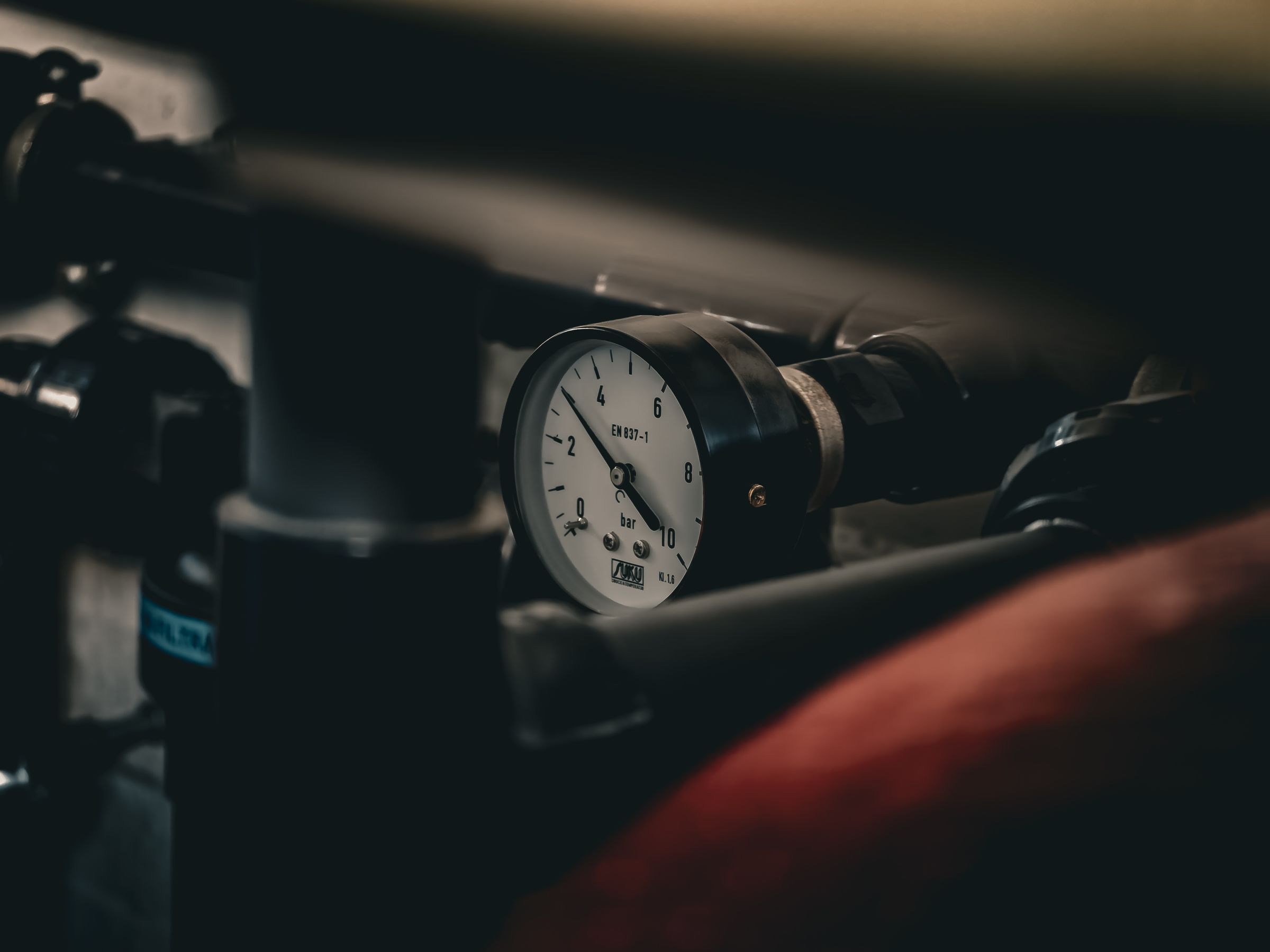 Close-up of a pressure gauge on mechanical equipment