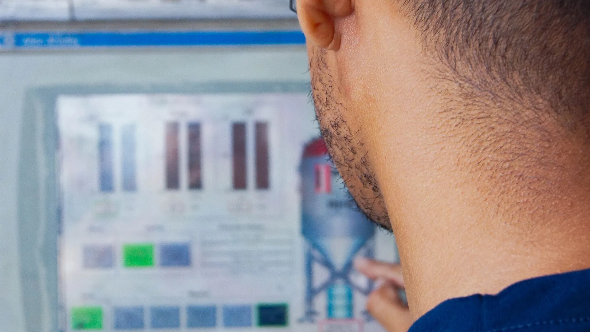 Technician reviewing building equipment controls
